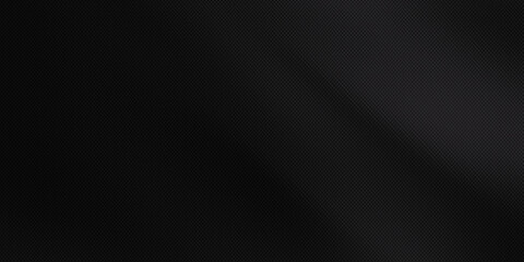 Obraz premium modern luxury black background with Carbon Fiber or Kevlar texture and subtle diagonal lighting effect that divides the image