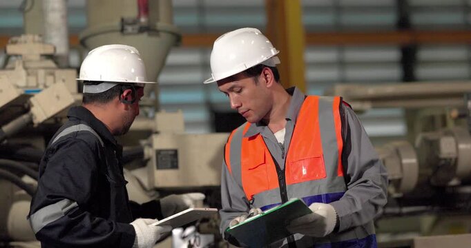 A supervisor mentors a technician using a rugged laptop beside a production machine in a manufacturing facility, showing digital supervision, faster troubleshooting, productivity, and process control.