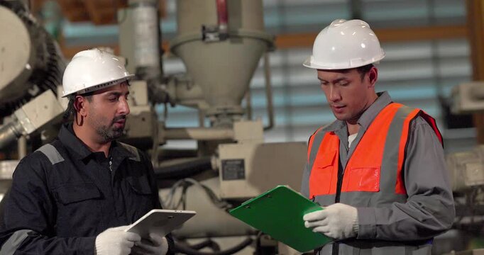 A supervisor mentors a technician using a rugged laptop beside a production machine in a manufacturing facility, showing digital supervision, faster troubleshooting, productivity, and process control.