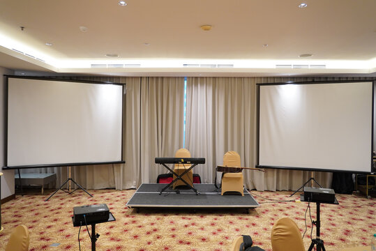 a professional indoor setup for a small event or presentation, likely in a hotel ballroom or conference room.