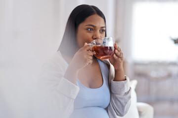 Pregnant, home and woman on sofa with tea for maternity health, calm and wellness in morning. Pregnancy, house and person with warm drink or herbal beverage for nutrition, comfort and relax on couch