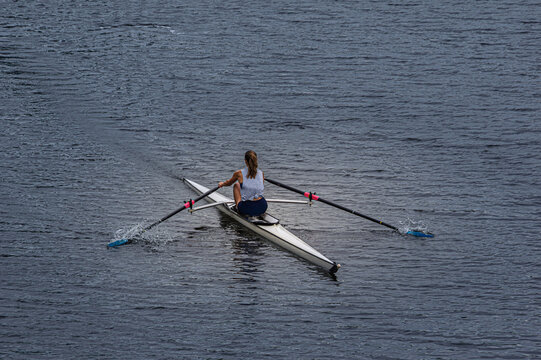 Solo Female Rower In Single Scull