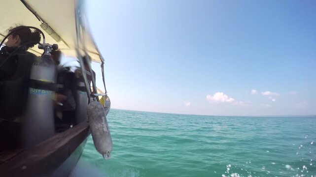 Sailboat sailing on open ocean with white sails billowing in wind, embarking on adventure and freedom voyage.

