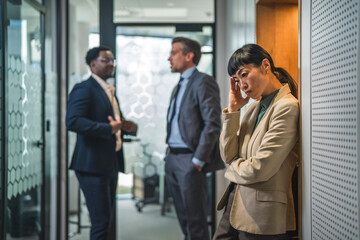 Fototapeta premium Stressed businesswoman experiencing workplace bullying or burnout in office