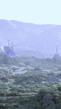 A large satellite dish towers in a peaceful valley, with mountains in the background. Lush greenery surrounds the structure. The sky is bright and the landscape appears tranquil.