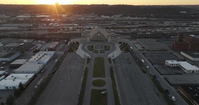 Aerial view of the iconic Cincinnati Union Terminal, a beacon of art deco architecture, bathed in the soft glow of the sunrise, Cincinnati, Ohio, United States.