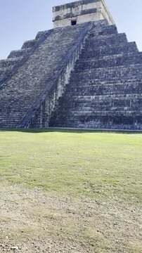 Tourist discovering the el castillo pyramid at chichen itza. Chichen itza