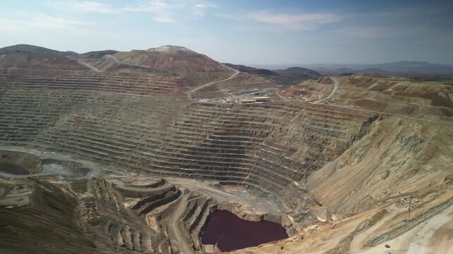 Aerial above large open copper mine in Santa Rita New Mexico