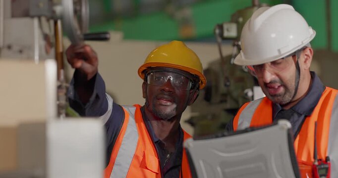 A supervisor mentors a technician using a rugged laptop beside a production machine in a manufacturing facility, showing digital supervision, faster troubleshooting, productivity, and process control.