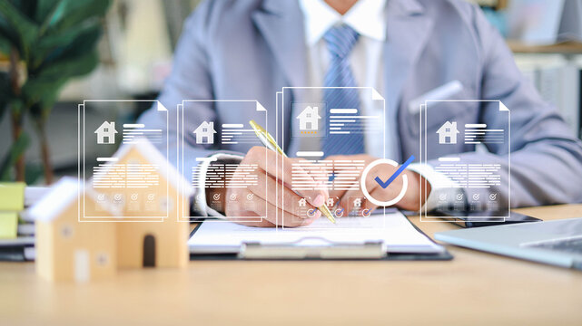Real estate agent signing property contract with digital document overlay, showcasing home approval, mortgage agreement, and secure transaction in modern business environment.