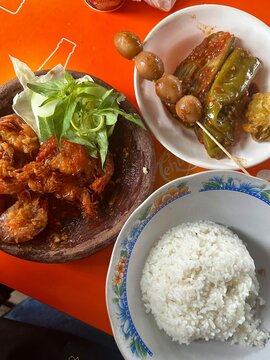 Rice with fried shrimps, quail egss, eggplants with sambal