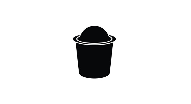 Simple black silhouette of a coffee capsule or pod with a circular design