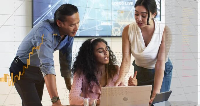 Seated woman typing on laptop initiating chart overlays while team leaning, pointing at tech data