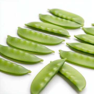 Flat snow peas with one opened pod showing seeds, isolated white background