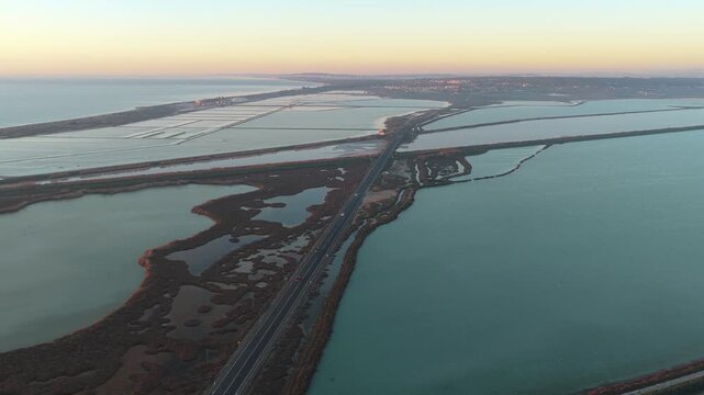 Aerial view of salinas de santa pola salt flats at sunset in spain