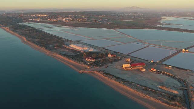 Aerial view of salinas de santa pola salt flats at sunset
