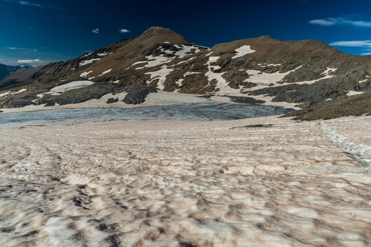 Rochemelon glacier bellow Rocciamelone mountain peak with peaks above in Graian Alps in France near borders with Italy