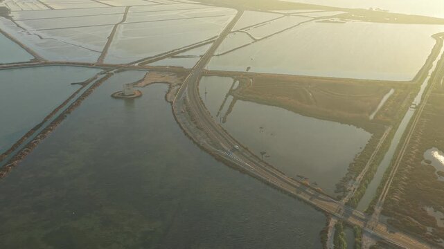 Aerial view of santa pola salt pans and road during sunset