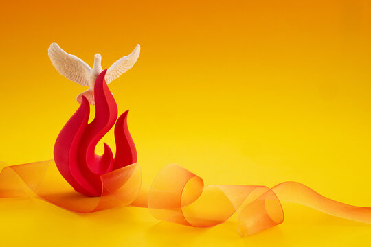 Pentecost holy spirit dove flame on yellow background