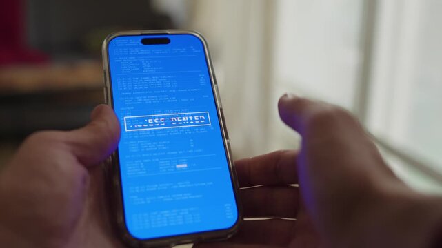 Person trying to unlock mobile phone after hacker or malware disabled access. Denied access to smart phone. Hacking remotely or virus taking over device. Error and glitch on screen inside home