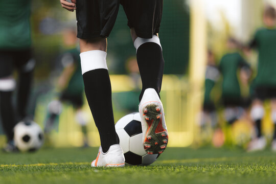Football Training Drills; Player Running Fast With Ball at Practice Pitch. Football Camp For Kids