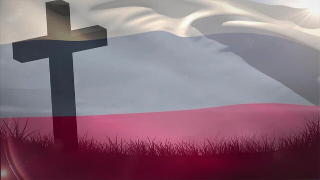 Wind gusting, dark cross standing, two-band flag rippling with sun glint over grass, for designers