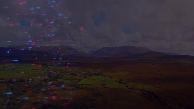 Vertical video: Showing moorland with fields and walls holding aerial, red blue lights forming left