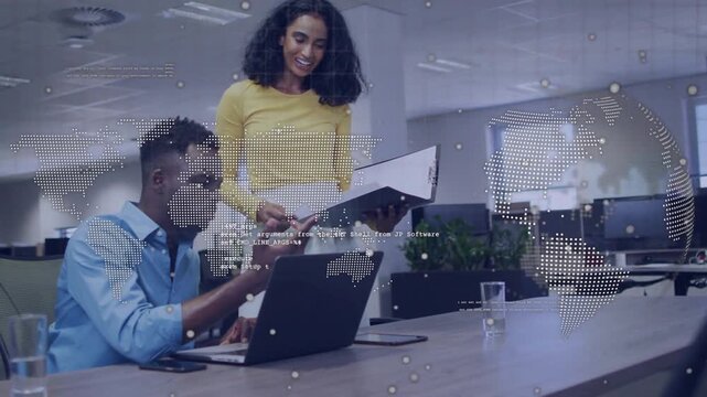 Vertical video: Coming woman and man sharing binder and typing at office with laptop overlay review