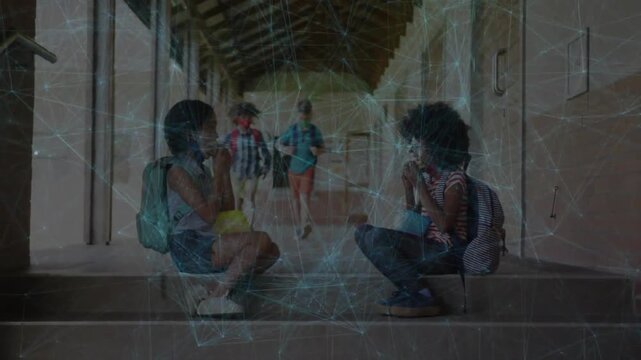 Two pupils eating snacks on school steps, network overlay tracking coming pupils passing to class