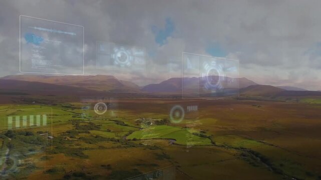 Sweeping rural valley centering while AR interface activating, faint HUD panels rising above fields