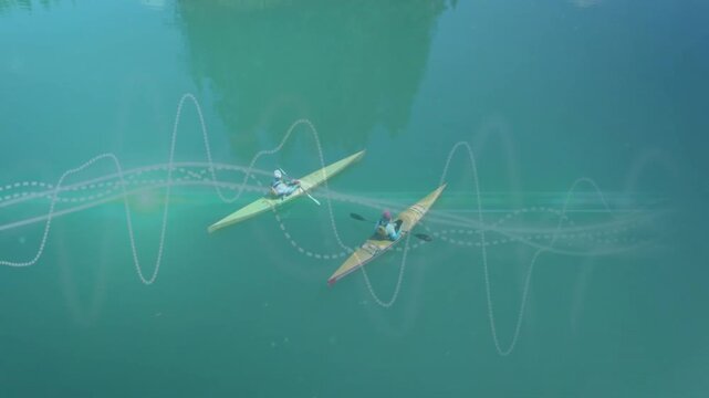 Two paddlers in kayaks starting strokes on green lake, tech waves flowing around boats for training