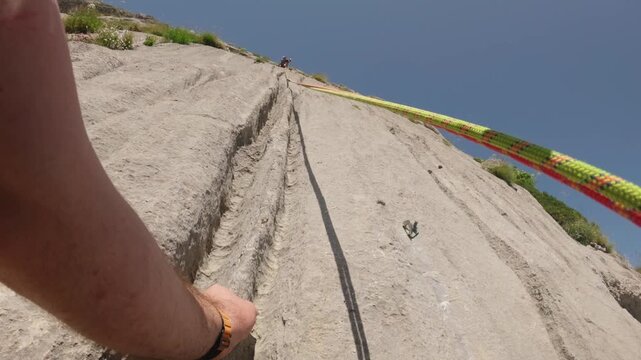 POV Rock Climber Unclipping Quickdraw on Pic de l'Aiguille