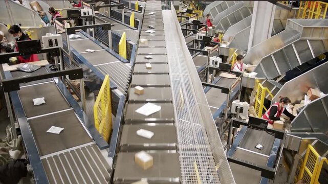 Modern automated factory production line with robotic arms and smart technology for efficient manufacturing.