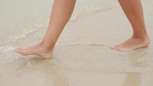 Playful caucasian woman splashing island shoreline, dress hem brushing water, energetic steps creating lively spray, beachcomber vibe, joyful summer motion and carefree holiday energy