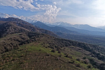 Fototapeta premium Spring blooming in the mountains. Talgar gorge. The view from the drone.