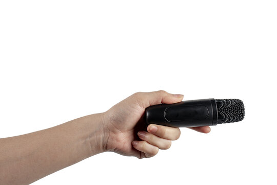 A small, black wireless microphone in hand, against a transparent background