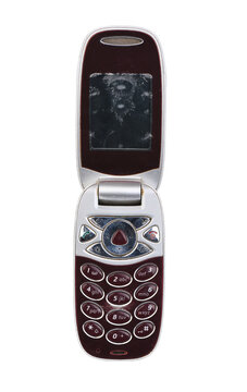 Vintage flip phone isolated on white, retro mobile cell phone.
