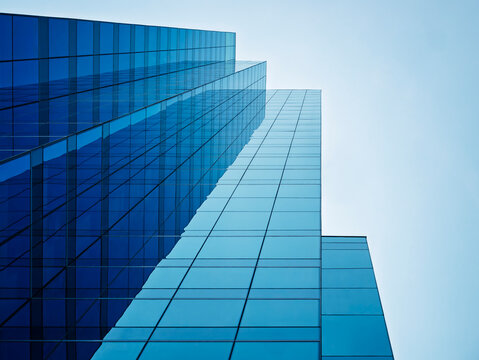 Architecture details Glass wall Modern building exterior Abstract background Low angle view