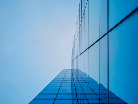 Architecture details Glass wall Modern building exterior Abstract background Low angle view