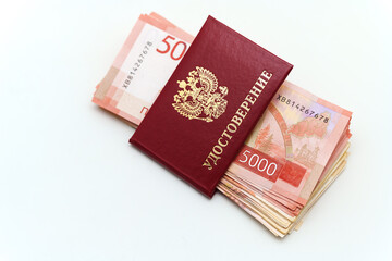 Fototapeta premium Identification and cash representing citizen benefits. the certificate is written in Russian
