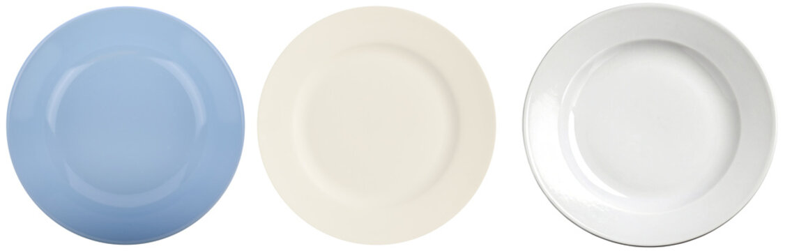 Assortment of clean empty ceramic plates in light blue, cream, and white colors, ready for food presentation.