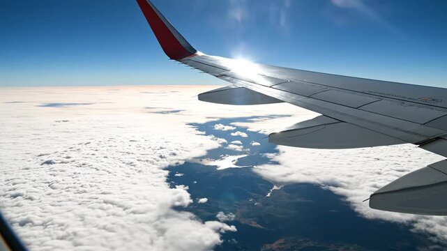 Airplane wing above clouds for commercial advertising, marketing campaigns, and creative projects