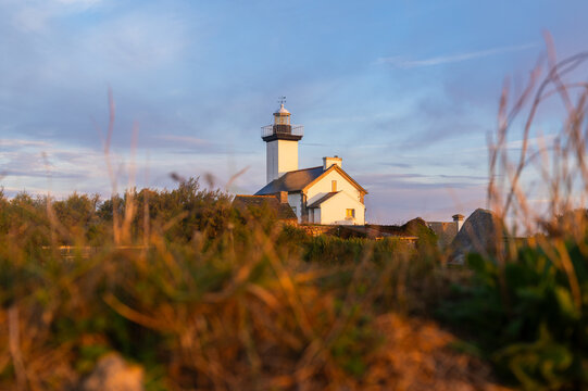 Pontusval lighthouse, Brittany, France. Sunrise coastal view, travel and tourism banner