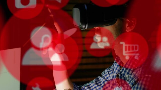 Animation of red computer icons over caucasian businessman using virtual reality simulator in office