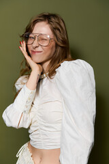 Young woman radiates style and charm with a playful wink and confident pose