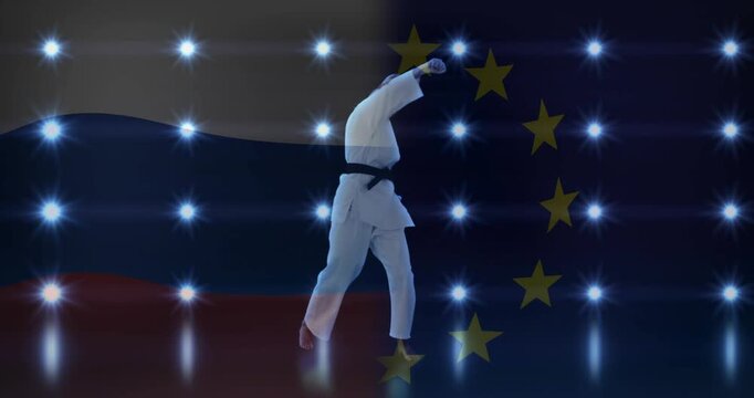 On studio cue female martial artist shifting weight, stepping, executing high punch, showing kata