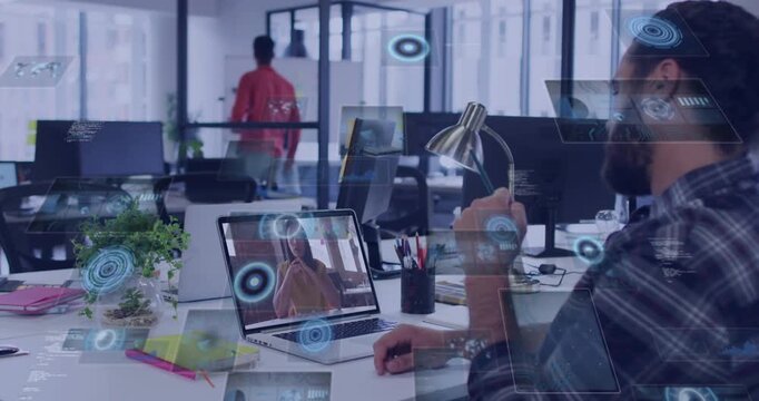 Bearded man at desk gesturing to laptop, remote call starting, AR panels sorting data for tech-team