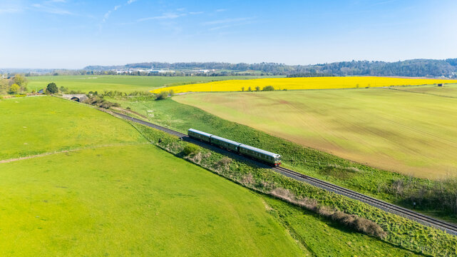 A retro diesel train in the countryside of Shropshire in the UK on a Spring day