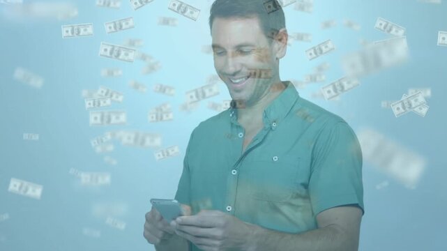 Man tapping phone and causing floating banknotes filling blue backdrop, reacting to finance payout