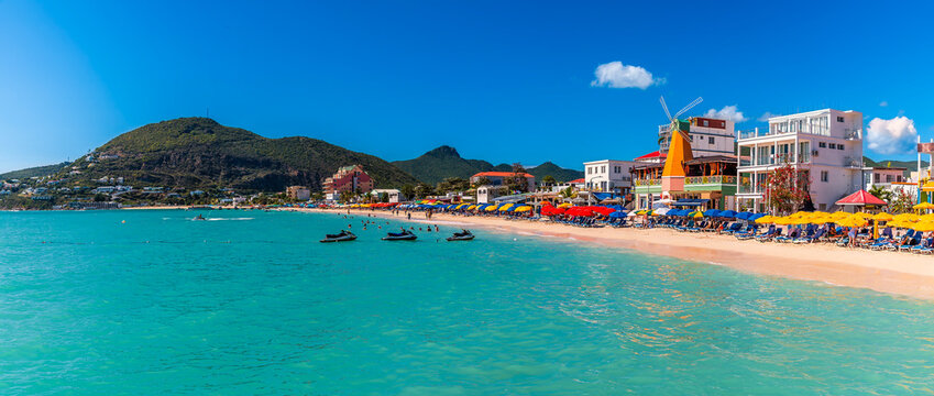 A panorama view along the west shoreline from the Great Bay Beach cove in Philipsburg, Sint Maarten on a sunny day